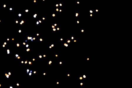 glitter lights on black backgroundの写真素材