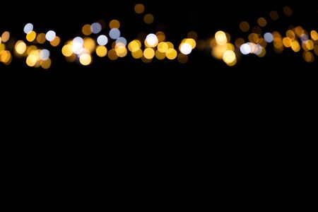 glitter lights on black backgroundの写真素材