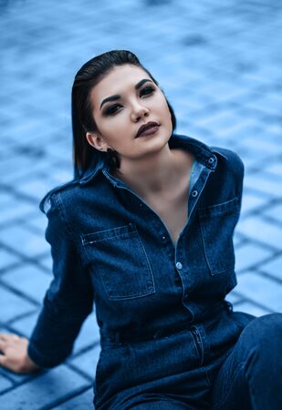 close up portrait of beautiful sexy young woman, in jeans costumeの写真素材