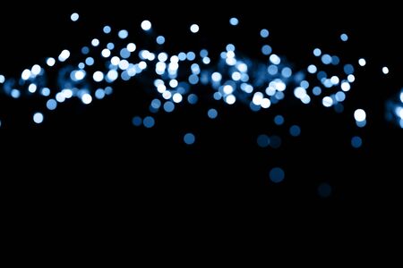 glitter lights on black backgroundの写真素材