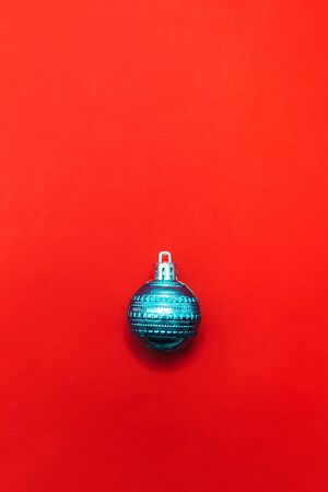 One christmas ball on red backgroundの写真素材