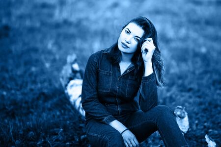 close up portrait of beautiful sexy young woman, in jeans costumeの写真素材