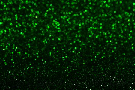 defocused green sparkles, lights blurred background, bokeh.の写真素材