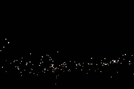 glitter lights on black backgroundの写真素材