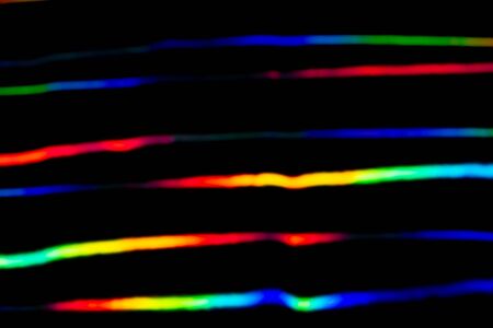 Holographic background with different colors. Holographic lines on black background. Neon line....