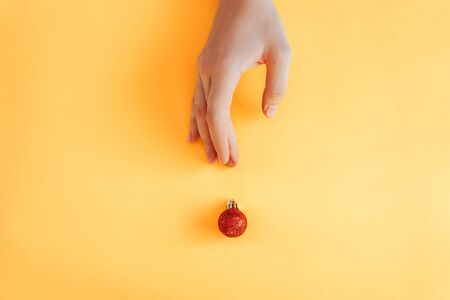 Creative concept. Christmas ball handの写真素材