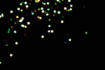 big green and golden bokeh for background on black. Christmas lights. overlay layerの写真素材