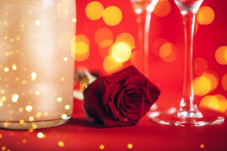 Valentines day background with champagne glasses and red roseの写真素材