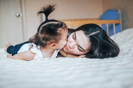 Lifestyle photo of mother and daughter at homeの写真素材