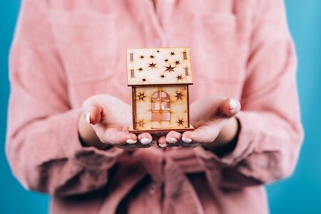 closeup picture of woman hands holding houseの写真素材