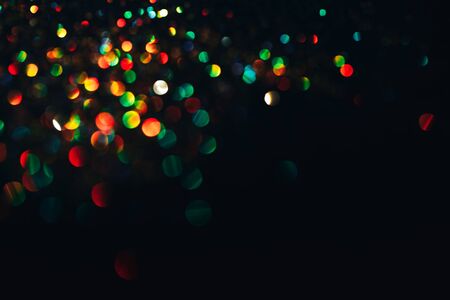 Color lights bokeh, colourfull sparkles on black backgrounds, overlay layer.の写真素材