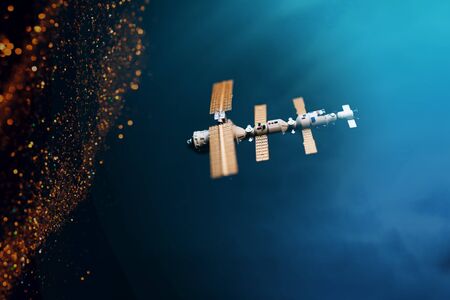 Space satellite orbiting the blue planetの写真素材
