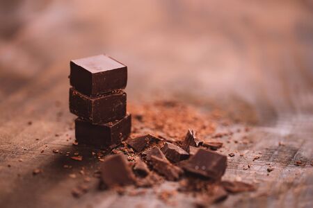 Dark chocolate on wooden tableの写真素材