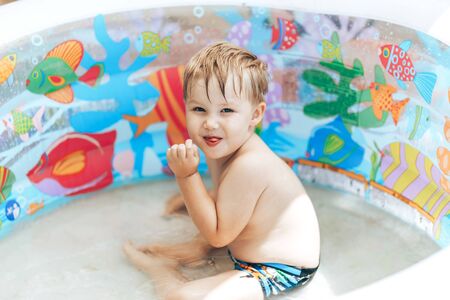 Smiling boy in the swimming-pool