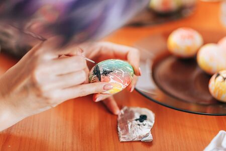 Woman paint eggs for Easter.の写真素材