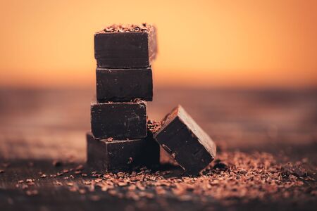 Dark chocolate on wooden table