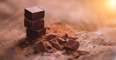 Dark chocolate on wooden tableの写真素材