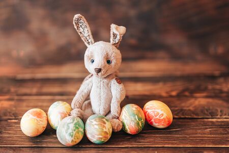 Colorful easter eggs and easter hand made rabbit.の写真素材