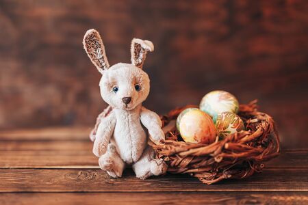 Colorful easter eggs and easter hand made rabbit.の写真素材