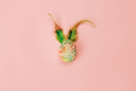 Color easter egg with rabbit earsの写真素材