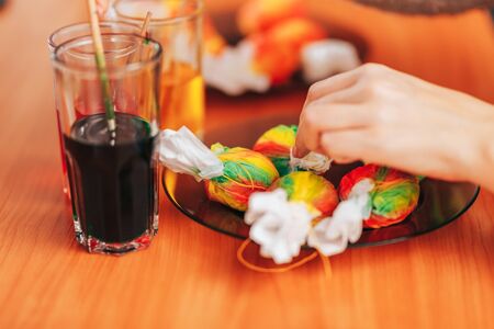 Woman paint eggs in napkins.の写真素材