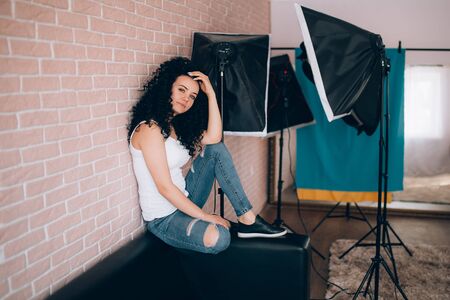 beautiful curly hair girl in studioの写真素材