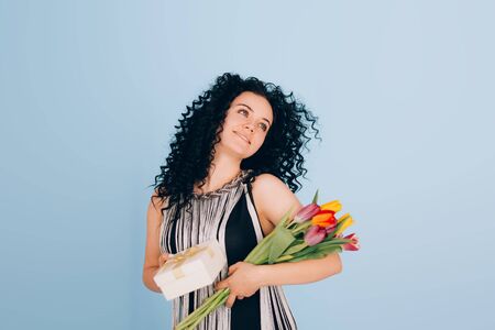 girl with a gift and flowersの写真素材