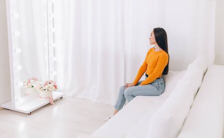 girl sitting in front of mirrorの写真素材