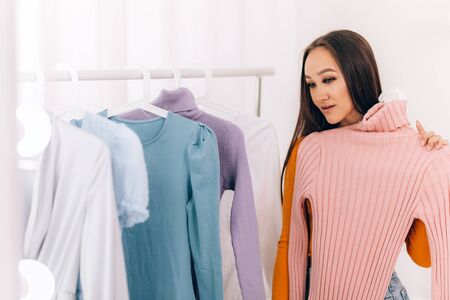 Girl chooses clothesの写真素材