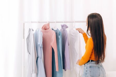 Girl chooses clothesの写真素材