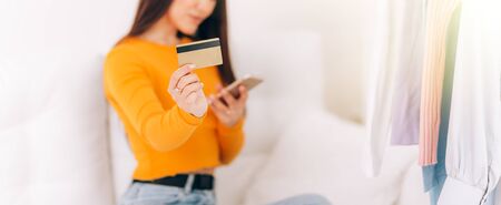 The girl pays for the purchaseの写真素材
