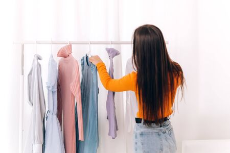 Girl chooses clothesの写真素材