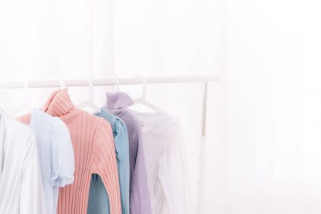 clothes hanging on hangersの写真素材