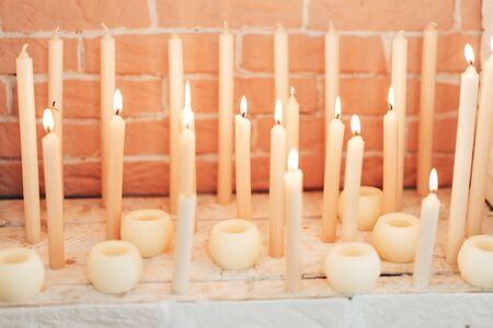 Burning candles. Many candles burning at night.の写真素材