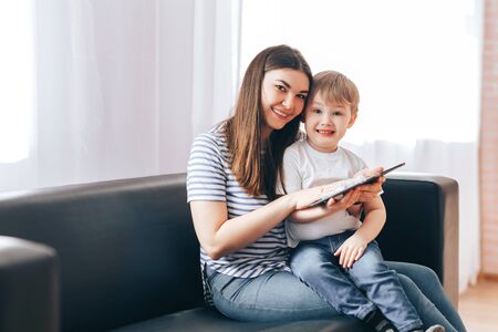 Mom and son wipe tabletの写真素材
