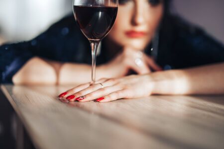 beautiful luxury woman with glass red wineの写真素材