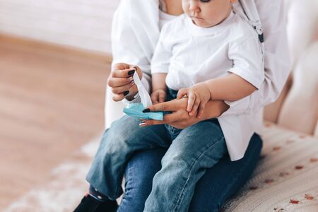 mom and baby rub their handsの写真素材