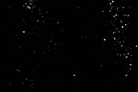 White snow on black backgroundの写真素材