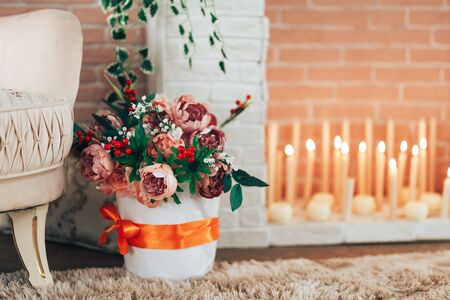 beautiful flowers with burning candlesの写真素材