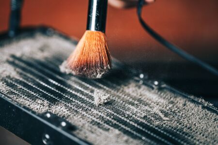 Cleaning the water cooling radiator grill from dirt, how to clean your computer, what to do at home during isolation, how to clean your computer from dirt and dustの写真素材