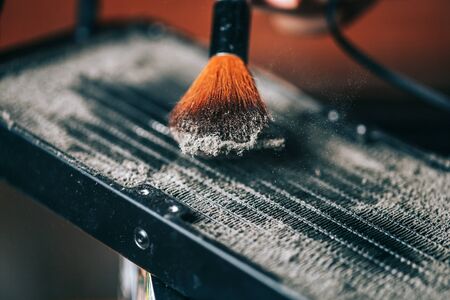 Cleaning the water cooling radiator grill from dirt, how to clean your computer, what to do at home during isolation, how to clean your computer from dirt and dustの写真素材
