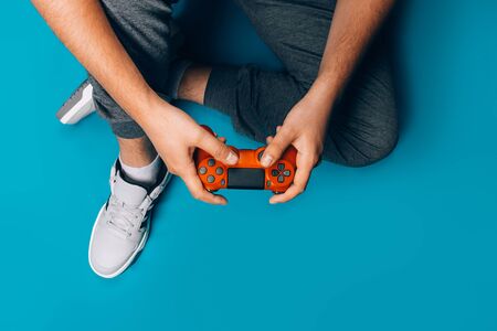 Young guy plays video games