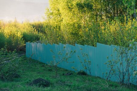 Metal gray fence made of profiled sheet, full insulation from the outsideの写真素材