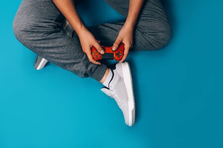 Young guy plays video gamesの写真素材