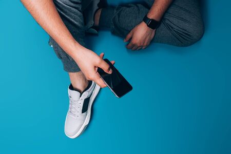 Guy holding smart phone