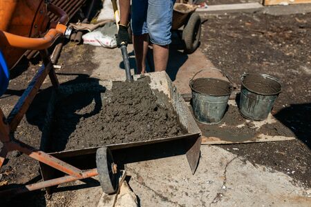 Work with cement mortar, pouring cement mortar wall, foundation and floorの写真素材