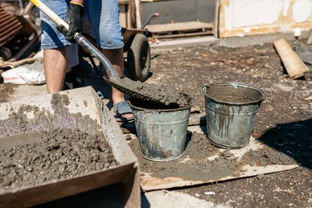 Work with cement mortar, pouring cement mortar wall, foundation and floor.の写真素材