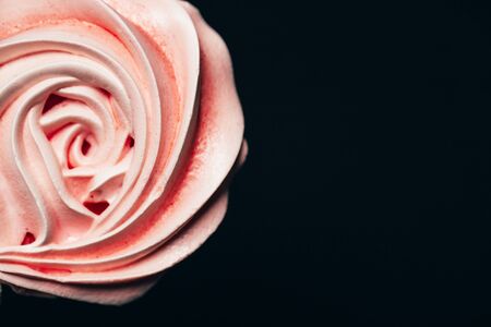 Beautiful tender meringue on a black background, March 8, mother's day, birthday present, sweets.の写真素材