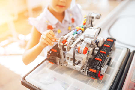Schoolgirl made a designer robot in a robotics class.
