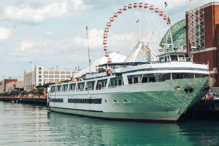 Big beautiful yacht docked in the bay of ships on a clear sunny day.の写真素材